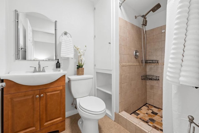 1409 Taft St, Escondido, CA 92026 - bathroom featuring vanity, tiled shower, toilet, and tile patterned flooring