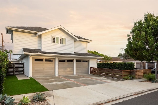 1792 Kenwood Pl, Costa Mesa, CA 92627 - view of front facade featuring an attached garage and driveway
