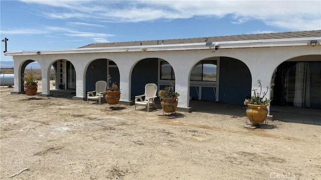 49225 45th St W, Lancaster, CA 93536 - rear view of property with stucco siding