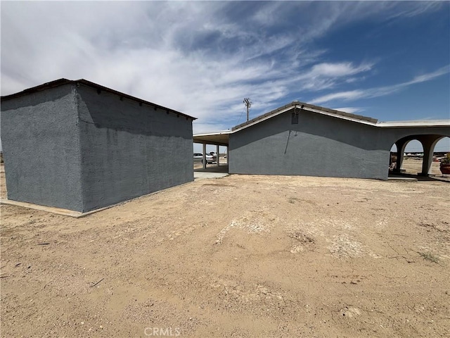 49225 45th St W, Lancaster, CA 93536 - view of side of property featuring stucco siding