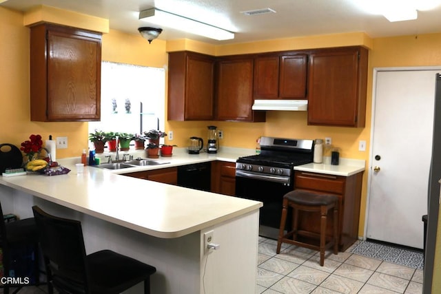 6232 Country View Ln, Riverside, CA 92504 - kitchen featuring stainless steel range with gas stovetop, under cabinet range hood, a peninsula, light countertops, and dishwasher