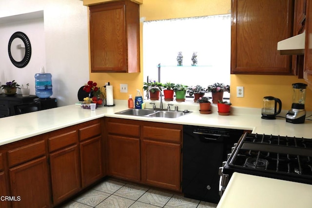 6232 Country View Ln, Riverside, CA 92504 - kitchen with black appliances, light countertops, light tile patterned floors, and extractor fan