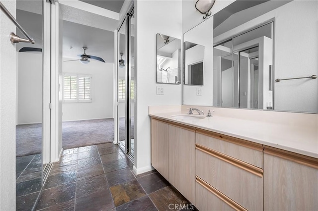503 Via Presa, San Clemente, CA 92672 - bathroom with stone tile flooring, ceiling fan, vanity, and baseboards