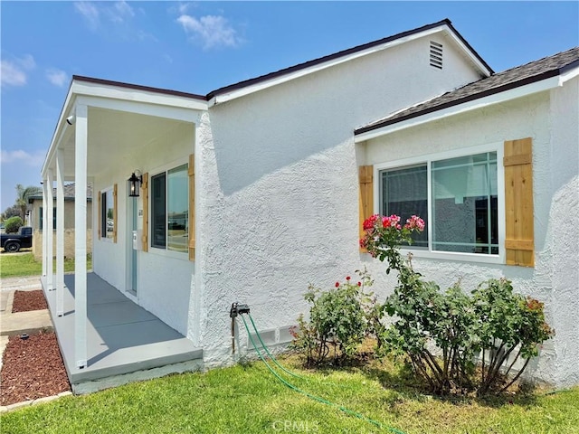 610 N Northwood Ave, Compton, CA 90220 - view of property exterior with stucco siding and a porch