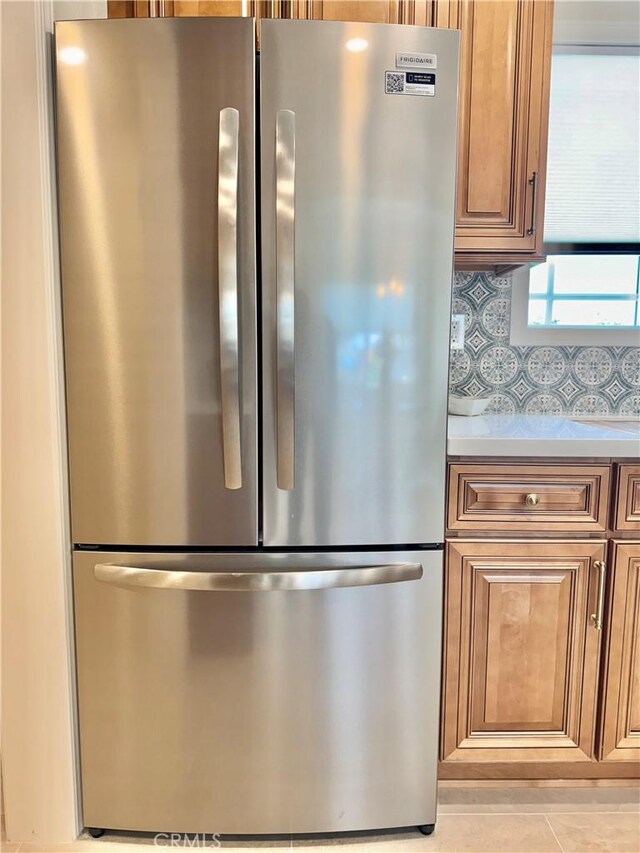 610 N Northwood Ave, Compton, CA 90220 - kitchen with freestanding refrigerator, light countertops, and backsplash