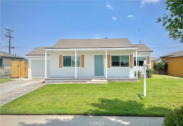 610 N Northwood Ave, Compton, CA 90220 - view of front facade with a porch, a garage, concrete driveway, and stucco siding