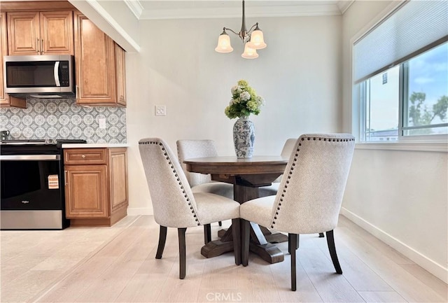 610 N Northwood Ave, Compton, CA 90220 - dining area with a chandelier, crown molding, and light wood-style floors