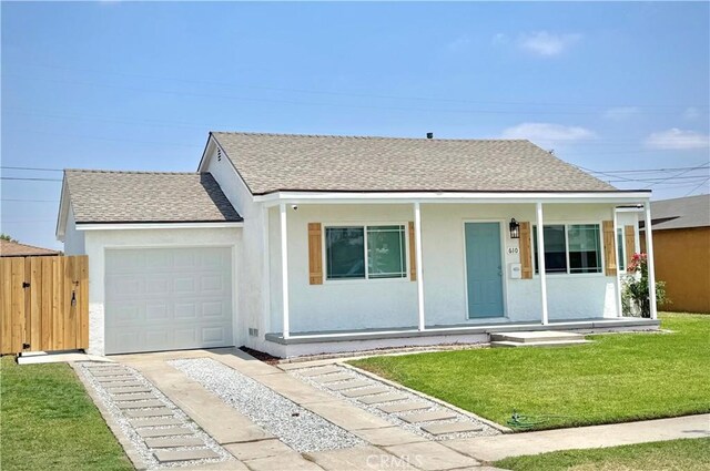 610 N Northwood Ave, Compton, CA 90220 - ranch-style house featuring roof with shingles, covered porch, stucco siding, and an attached garage