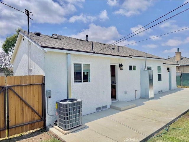 610 N Northwood Ave, Compton, CA 90220 - back of property featuring stucco siding, a patio, a gate, and a shingled roof