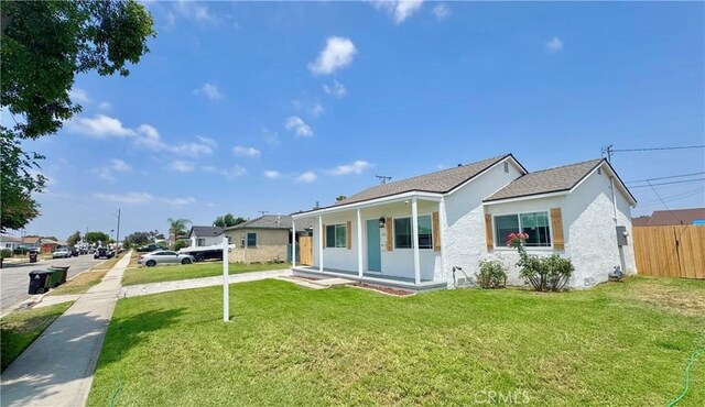 610 N Northwood Ave, Compton, CA 90220 - view of front facade with stucco siding and a porch
