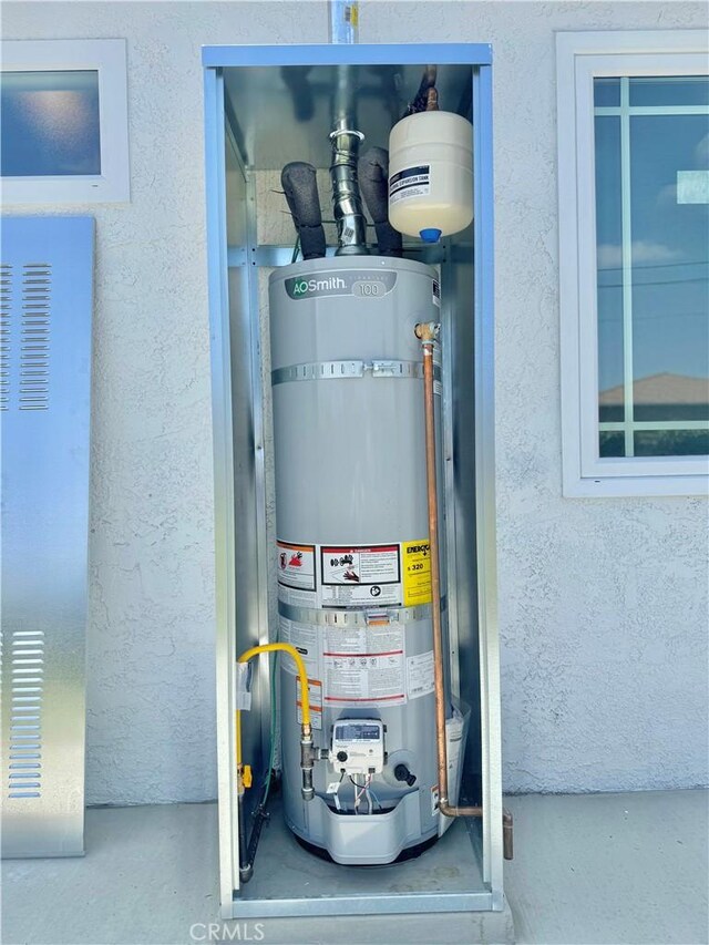 610 N Northwood Ave, Compton, CA 90220 - utilities with strapped water heater and a heating unit