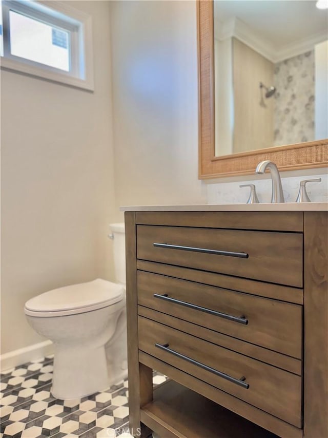610 N Northwood Ave, Compton, CA 90220 - half bathroom with tile patterned floors, vanity, and crown molding