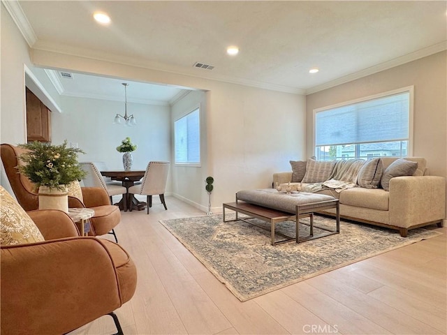 610 N Northwood Ave, Compton, CA 90220 - living room featuring plenty of natural light, a chandelier, light wood-type flooring, recessed lighting, and ornamental molding