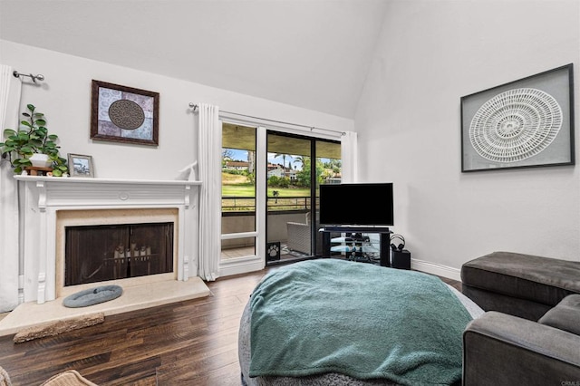 2537 Navarra Dr Unit 9B, Carlsbad, CA 92009 - living area with a fireplace with raised hearth, wood finished floors, baseboards, and high vaulted ceiling
