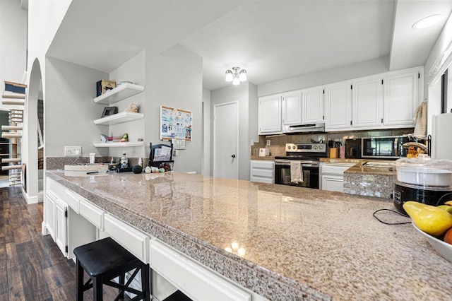 2537 Navarra Dr Unit 9B, Carlsbad, CA 92009 - kitchen with stainless steel range with electric stovetop, extractor fan, tile countertops, dark wood-type flooring, and white cabinets