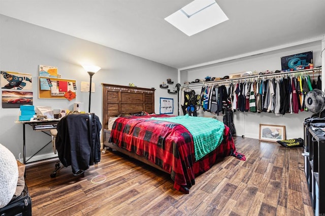 2537 Navarra Dr Unit 9B, Carlsbad, CA 92009 - bedroom featuring a skylight and wood finished floors