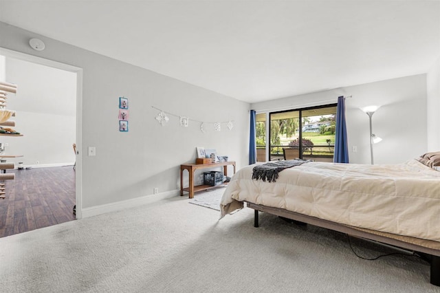2537 Navarra Dr Unit 9B, Carlsbad, CA 92009 - bedroom with access to exterior, baseboards, and wood finished floors