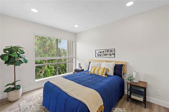 2900 S Greenville S Unit H, Santa Ana, CA 92704 - bedroom with baseboards, wood finished floors, and recessed lighting