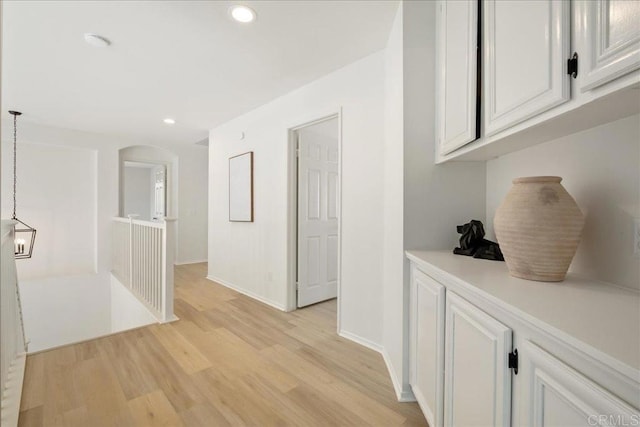 29589 Hazel Glen Rd, Murrieta, CA 92563 - hall featuring light wood-type flooring, recessed lighting, baseboards, and arched walkways