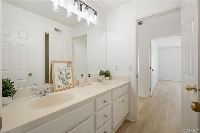 29589 Hazel Glen Rd, Murrieta, CA 92563 - full bath with double vanity and wood finished floors
