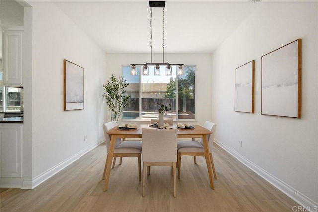 29589 Hazel Glen Rd, Murrieta, CA 92563 - dining room featuring light wood-style floors and baseboards