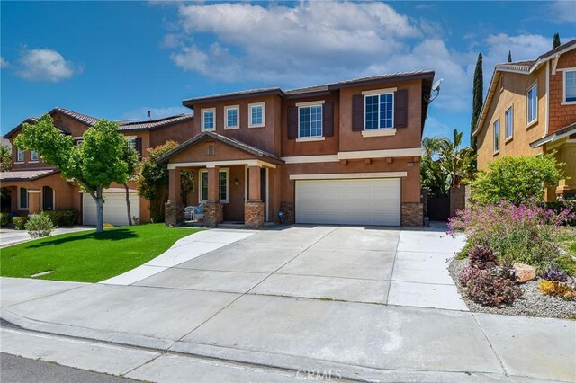 38919 Hickory Hill Ct, Murrieta, CA 92563 - view of front facade featuring a garage, stucco siding, concrete driveway, covered porch, and stone siding