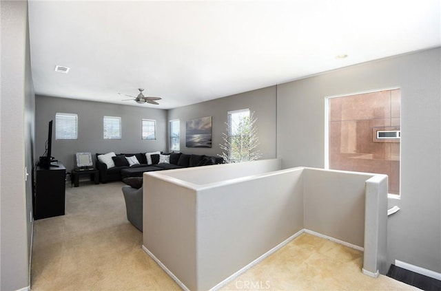 38919 Hickory Hill Ct, Murrieta, CA 92563 - unfurnished living room featuring light colored carpet and a ceiling fan