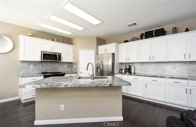38919 Hickory Hill Ct, Murrieta, CA 92563 - kitchen with appliances with stainless steel finishes, dark wood-style floors, and decorative backsplash