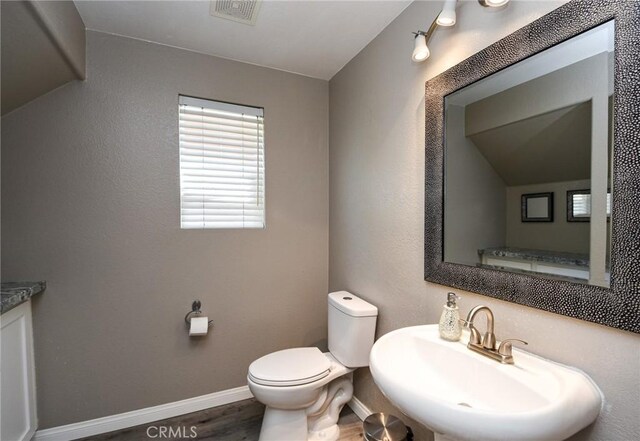 38919 Hickory Hill Ct, Murrieta, CA 92563 - half bath with a sink and wood finished floors