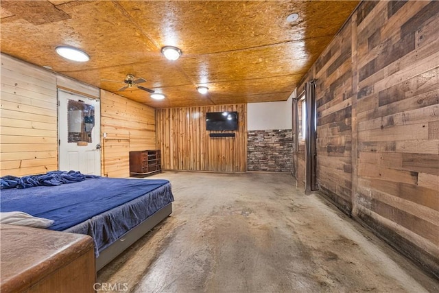 56225 Moonstone Ln, Yucca Valley, CA 92284 - bedroom featuring wooden walls and unfinished concrete flooring