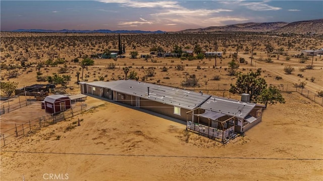 56225 Moonstone Ln, Yucca Valley, CA 92284 - aerial view at dusk of a desert view, a mountain view, and a rural view