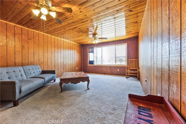 56225 Moonstone Ln, Yucca Valley, CA 92284 - carpeted living room featuring ceiling fan, wood ceiling, and wood walls