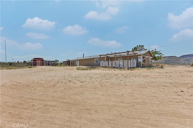 56225 Moonstone Ln, Yucca Valley, CA 92284 - view of yard with an outbuilding