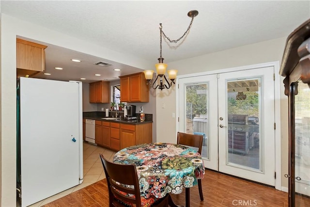 9614 Peach Ave, Hesperia, CA 92345 - dining area featuring a chandelier, french doors, and recessed lighting