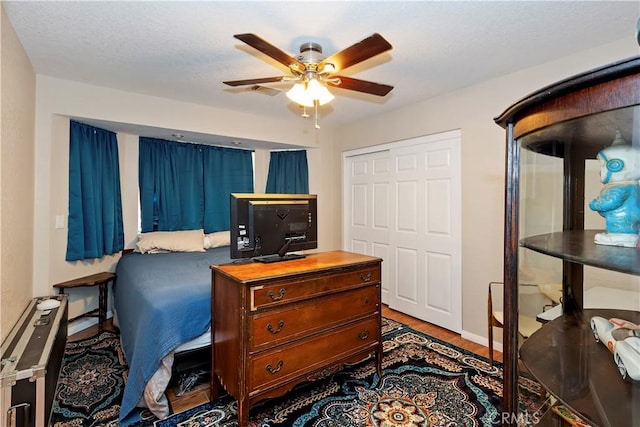 9614 Peach Ave, Hesperia, CA 92345 - bedroom featuring wood finished floors, a closet, and ceiling fan