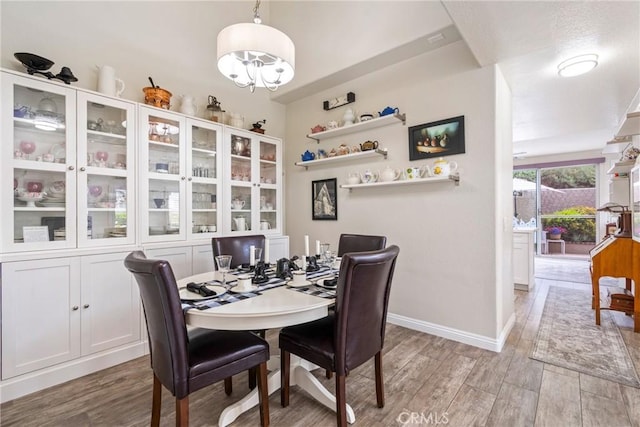 2141 Triador St Unit 103, Corona, CA 92879 - dining space featuring light wood-style floors and baseboards