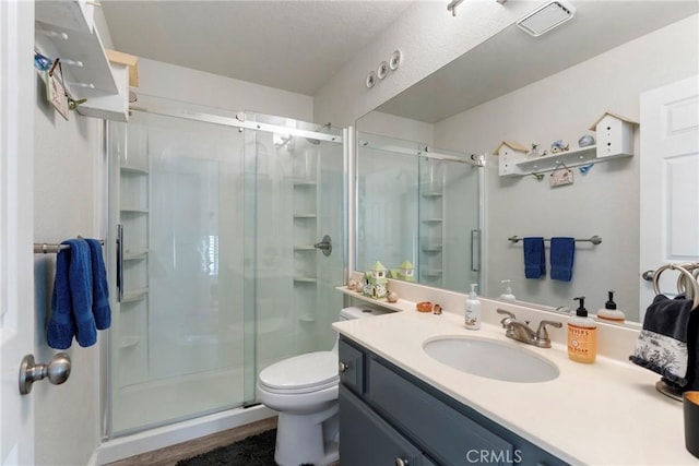 2141 Triador St Unit 103, Corona, CA 92879 - full bathroom with a stall shower, vanity, and toilet