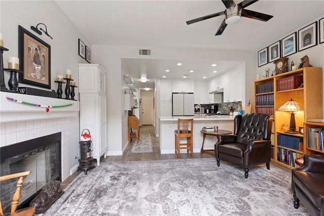 2141 Triador St Unit 103, Corona, CA 92879 - living room with ceiling fan, recessed lighting, a tile fireplace, and baseboards