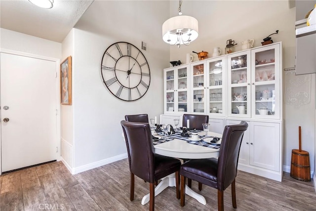 2141 Triador St Unit 103, Corona, CA 92879 - dining space with wood finished floors, baseboards, and a chandelier