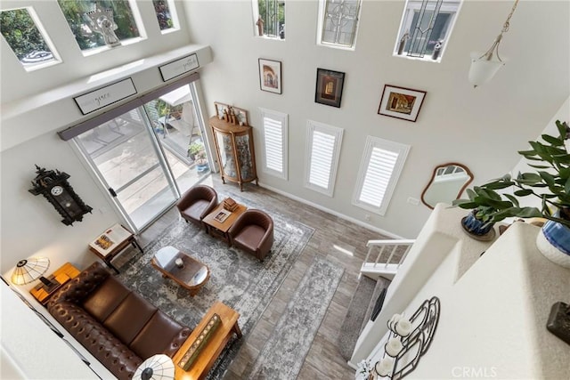 2141 Triador St Unit 103, Corona, CA 92879 - living room featuring a towering ceiling and baseboards
