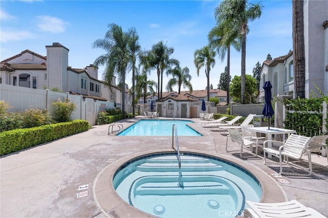 2141 Triador St Unit 103, Corona, CA 92879 - community pool featuring a community hot tub, a patio, and a residential view