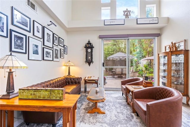 2141 Triador St Unit 103, Corona, CA 92879 - living room featuring a towering ceiling and wood finished floors