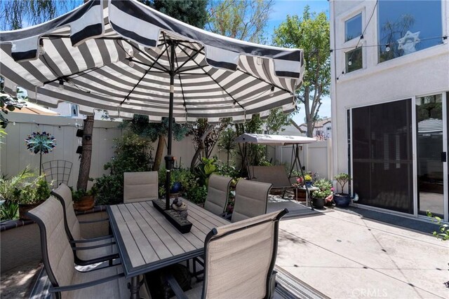 2141 Triador St Unit 103, Corona, CA 92879 - fenced backyard featuring outdoor dining area and a patio