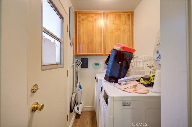 866 Brighton Ave, Grover Beach, CA 93433 - laundry area featuring washer and clothes dryer, cabinet space, and wood finished floors