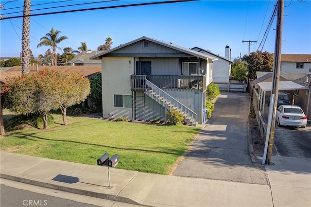 866 Brighton Ave, Grover Beach, CA 93433 - view of front of house featuring a front lawn, stairs, and driveway