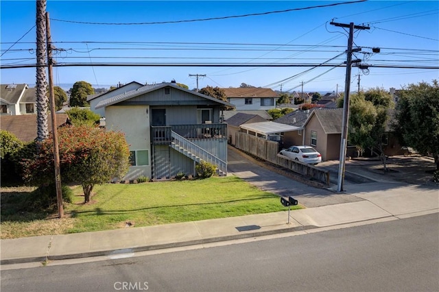 866 Brighton Ave, Grover Beach, CA 93433 - view of front facade with a front yard, a residential view, and stairway