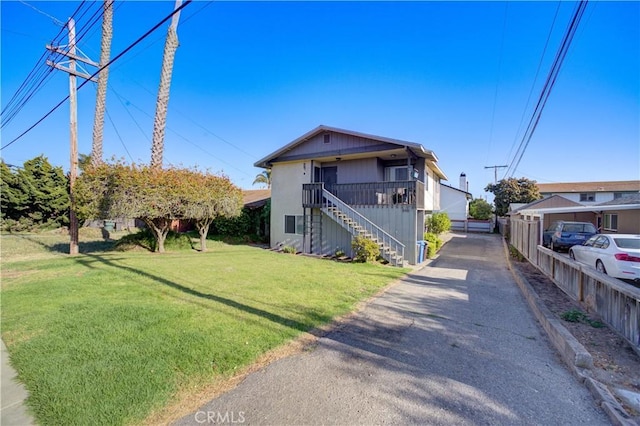 866 Brighton Ave, Grover Beach, CA 93433 - view of front of property with stairway, a front lawn, and asphalt driveway