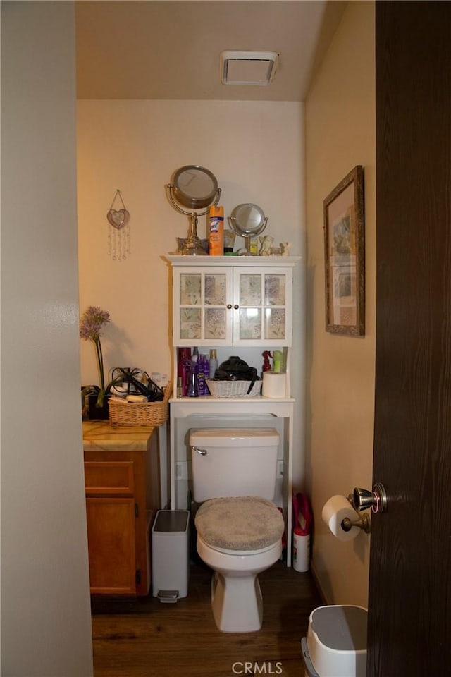 866 Brighton Ave, Grover Beach, CA 93433 - half bathroom featuring toilet and wood finished floors