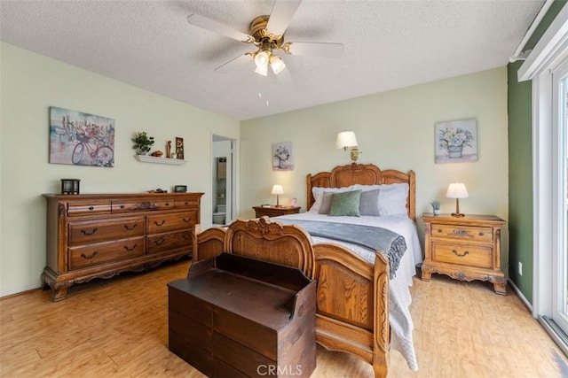20121 Swansea Ln, Huntington Beach, CA 92646 - bedroom featuring light wood-type flooring, a textured ceiling, ceiling fan, and ensuite bathroom