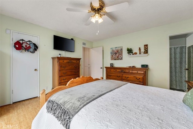 20121 Swansea Ln, Huntington Beach, CA 92646 - bedroom with wood finished floors, a textured ceiling, and a ceiling fan